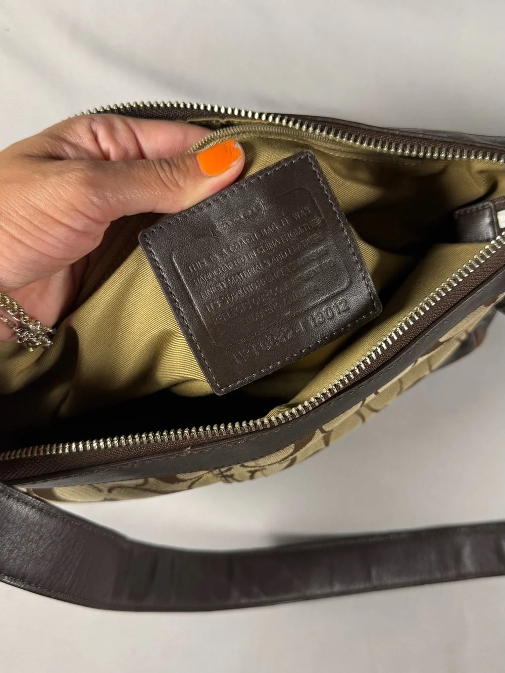 vintage Y2K-era signature canvas and leather hobo/shoulder bag
